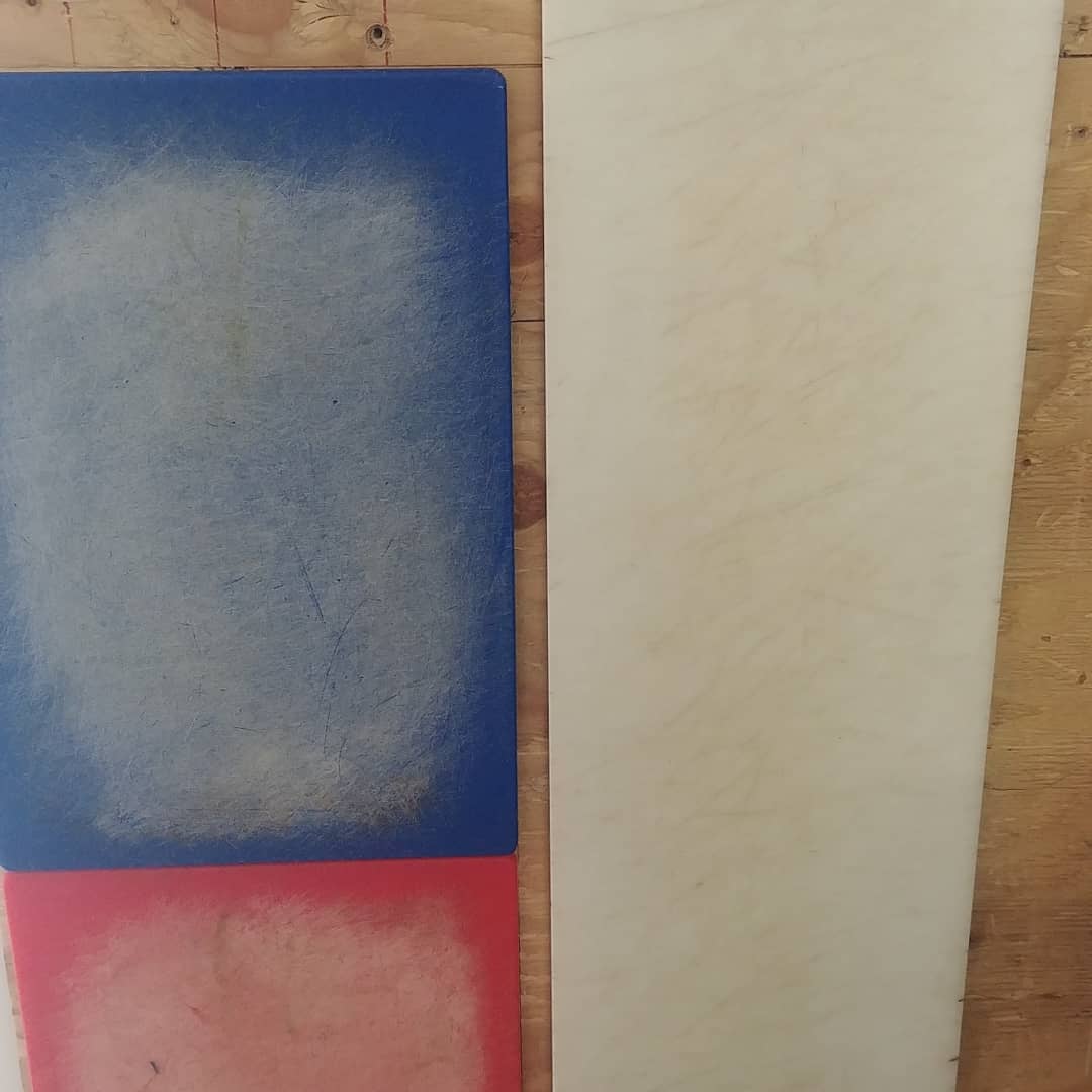 Worn commercial cutting board before resurfacing in Edmonton